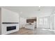 Spacious living room with a modern fireplace and adjacent kitchen at 1311 Rock Cliff Ave, Erie, CO 80516