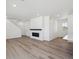 Bright living space featuring a modern fireplace, wood-look floors, and an open floor plan at 1311 Rock Cliff Ave, Erie, CO 80516