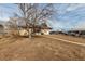 Large backyard with a mix of open space and mature trees at 2700 W 91St Ave, Denver, CO 80260