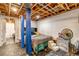Cozy basement bedroom with exposed wooden ceiling, painted walls, and carpeted floors at 2700 W 91St Ave, Denver, CO 80260