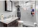 Well-lit bathroom with a tub/shower combo and modern vanity at 2700 W 91St Ave, Denver, CO 80260