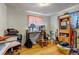 Multi-purpose bonus room with hardwood floors, featuring a desk and additional storage at 2700 W 91St Ave, Denver, CO 80260