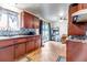 Charming kitchen with sleek countertops, tile flooring, and adjacent dining area, for easy meals at 2700 W 91St Ave, Denver, CO 80260
