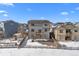 Aerial view of a two-story house and surrounding homes in a residential area at 1018 Mcmurdo Cir, Castle Rock, CO 80108