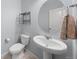 Small, updated powder room with pedestal sink and toilet at 1018 Mcmurdo Cir, Castle Rock, CO 80108