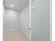 Small, unfinished basement room with frosted glass door at 1018 Mcmurdo Cir, Castle Rock, CO 80108