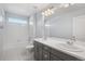 Bathroom with double vanity and a bathtub at 1018 Mcmurdo Cir, Castle Rock, CO 80108