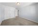 Simple bedroom with double doors leading to another room at 1018 Mcmurdo Cir, Castle Rock, CO 80108