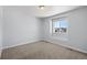 Bright bedroom with neutral walls and carpet at 1018 Mcmurdo Cir, Castle Rock, CO 80108