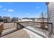 Spacious deck with wooden railings, offering scenic views of the neighborhood at 1018 Mcmurdo Cir, Castle Rock, CO 80108