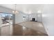 Dining room with hardwood floors, a chandelier, and access to a deck at 1018 Mcmurdo Cir, Castle Rock, CO 80108