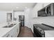 Bright kitchen featuring stainless steel appliances and white cabinetry at 1018 Mcmurdo Cir, Castle Rock, CO 80108