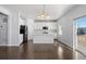 Modern kitchen with white cabinets, an island, and hardwood floors at 1018 Mcmurdo Cir, Castle Rock, CO 80108