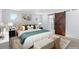 Main bedroom with barn door and stylish decor at 1018 Mcmurdo Cir, Castle Rock, CO 80108