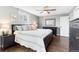 Bedroom features hardwood floors, a ceiling fan and lots of natural light at 915 Mercury Cir, Littleton, CO 80124