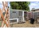 This backyard features a functional chicken coop with a run, offering a rustic touch and potential for sustainable living at 915 Mercury Cir, Littleton, CO 80124