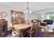 Elegant dining room with a large wooden table, hardwood floors, and classic furnishings with plenty of space at 915 Mercury Cir, Littleton, CO 80124