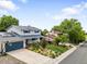 Inviting two-story home boasts a well-kept yard, solar panels, and a convenient two-car garage at 915 Mercury Cir, Littleton, CO 80124
