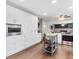 Bright kitchen features custom white cabinets, wood floors and an island prep station at 915 Mercury Cir, Littleton, CO 80124