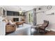 Cozy living room with brick fireplace and access to an outdoor patio at 915 Mercury Cir, Littleton, CO 80124
