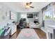 The living room is a serene and stylish space with a ceiling fan, modern decor, and a comfortable workspace at 915 Mercury Cir, Littleton, CO 80124