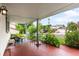 Cozy porch with outdoor seating and string lights offers a relaxing view of the neighborhood at 915 Mercury Cir, Littleton, CO 80124