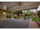 Cozy covered back porch overlooking a lovely, shaded backyard at 2840 S Yates St, Denver, CO 80236