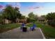 Charming backyard with a fire pit area and beautifully landscaped surroundings at 2840 S Yates St, Denver, CO 80236