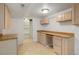 Bright basement features storage, shelving, and ample counter space at 2840 S Yates St, Denver, CO 80236