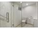 Modern bathroom featuring a glass-enclosed shower, a new toilet, and a modern vanity at 2840 S Yates St, Denver, CO 80236