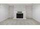 Elegant white brick fireplace with a black insert and stone hearth, perfect for cozy evenings at 2840 S Yates St, Denver, CO 80236