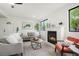 Inviting living room with a fireplace, comfortable seating, and a bright, airy atmosphere at 2840 S Yates St, Denver, CO 80236