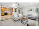 Spacious living room with direct access to the kitchen, ideal for open-concept living at 2840 S Yates St, Denver, CO 80236