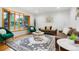 Bright living room with hardwood floors, bay window, modern furniture, and stylish decor at 2840 S Yates St, Denver, CO 80236