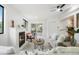 Cozy living room featuring a fireplace, backyard access, and a comfortable seating area at 2840 S Yates St, Denver, CO 80236