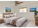 Bright bedroom featuring a ceiling fan, neutral walls, and tasteful decor at 390 Zang St # 5-102, Lakewood, CO 80228