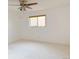 Spacious bedroom with large window, neutral carpet and off white walls at 390 Zang St # 5-102, Lakewood, CO 80228