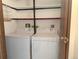 Laundry room featuring full size washer, dryer, shelving and a black accent stripe at 390 Zang St # 5-102, Lakewood, CO 80228