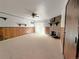 Spacious living room with a fireplace, sliding glass doors, and wood look accent paneling at 390 Zang St # 5-102, Lakewood, CO 80228