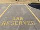 Reserved parking spot with painted yellow lines and number 189 in a well-maintained lot at 390 Zang St # 5-102, Lakewood, CO 80228