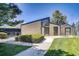 Pool house with green space in front of the property and blue skies above at 390 Zang St # 5-102, Lakewood, CO 80228