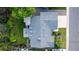 Aerial view of home, showcasing landscaped yard, roof, and driveway at 8696 W Iliff Ave, Lakewood, CO 80227