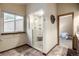 Bathroom featuring a glass enclosed shower, modern fixtures, and tile flooring at 8696 W Iliff Ave, Lakewood, CO 80227