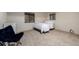 Cozy bedroom features natural light, neutral walls, and comfortable carpet at 8696 W Iliff Ave, Lakewood, CO 80227
