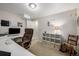 Bright home office with a large desk, comfortable chair, and ample storage space at 8696 W Iliff Ave, Lakewood, CO 80227