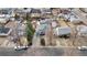 Aerial view of a well-maintained home with a driveway and landscaped front yard in a quiet neighborhood at 2381 Newark St, Aurora, CO 80010