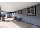Covered patio with a bench, table, chairs and grill is perfect for outdoor entertaining at 2381 Newark St, Aurora, CO 80010
