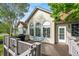 Exterior view of the back deck, complete with an outdoor grill and comfortable seating, perfect for entertaining at 1752 Peninsula Cir, Castle Rock, CO 80104
