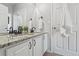 Elegant bathroom with double sink vanity, granite countertop, and modern fixtures at 1752 Peninsula Cir, Castle Rock, CO 80104