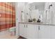 Bright bathroom featuring double sinks, granite counters, and a separate toilet and shower at 1752 Peninsula Cir, Castle Rock, CO 80104